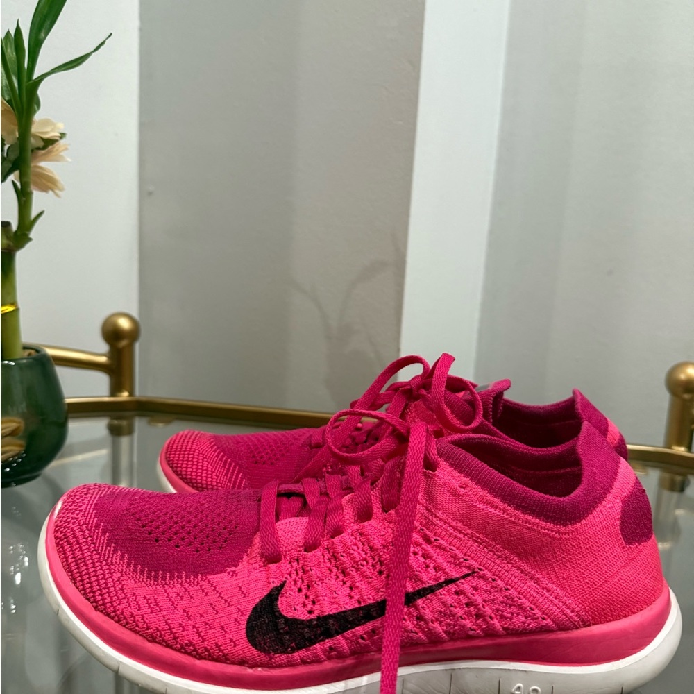 Nike Pink Flyknit Athletic Shoes with Sock-Like Collar, in very good condition